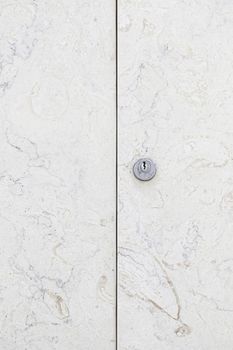 Marble door closed, detail of a stone door, decoration and protection