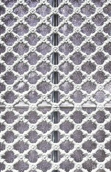 Old metal gate decorated, detail of an old fence painted white, protection and decoration