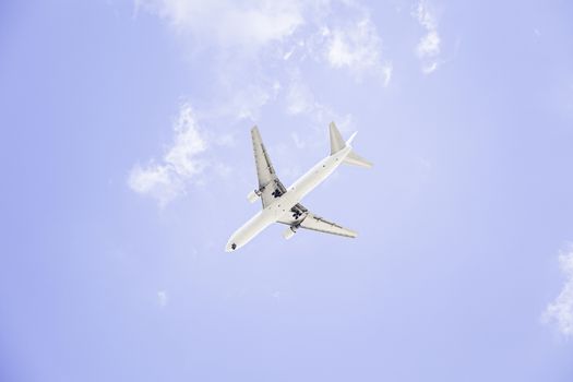  Cargo aircraft in flight, is isolated on a blue background 