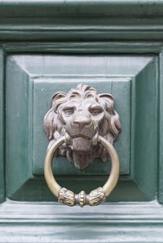 Caller shaped golden lion, detail of an ancient decorated door, ancient art 