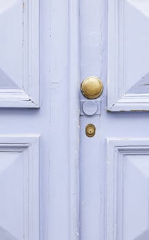 Old blue wooden door, detail of a painted blue, protection and security door
