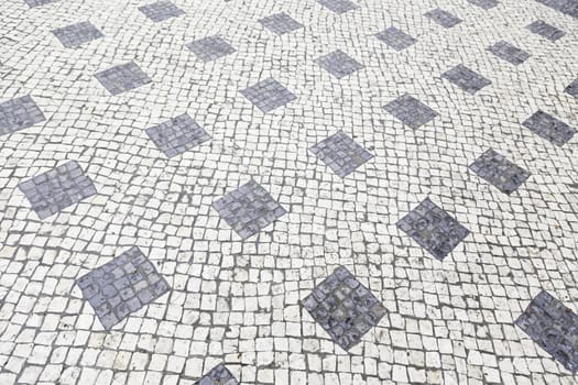 Typical stone floor Lisbon, detail of a typical floor with shapes and drawings, art Portugal, tourism