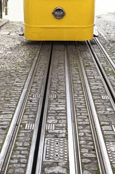 Old yellow tram of Lisbon, detail of an ancient means of transport, monument Portugal