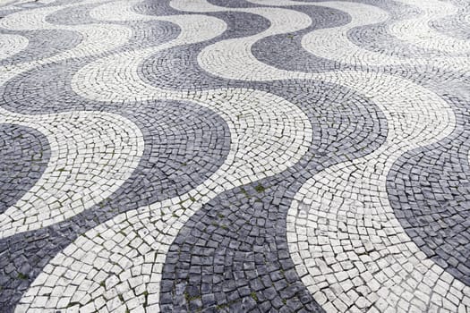 Typical stone floor Lisbon, detail of a typical floor with shapes and drawings, art Portugal, tourism