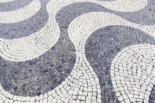 Typical stone floor Lisbon, detail of a typical floor with shapes and drawings, art Portugal, tourism