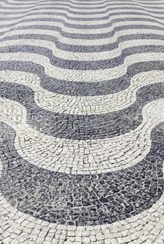 Typical stone floor Lisbon, detail of a typical floor with shapes and drawings, art Portugal, tourism