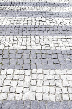 Typical stone floor Lisbon, detail of a typical floor with shapes and drawings, art Portugal, tourism