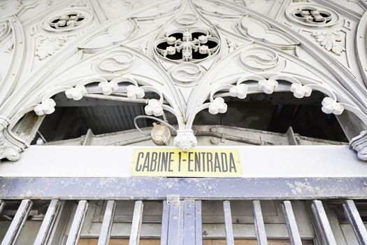 Entry of an elevator, detail of an old metal door closed