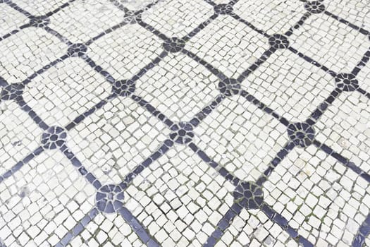 Typical stone floor Lisbon, detail of a typical floor with shapes and drawings, art Portugal, tourism