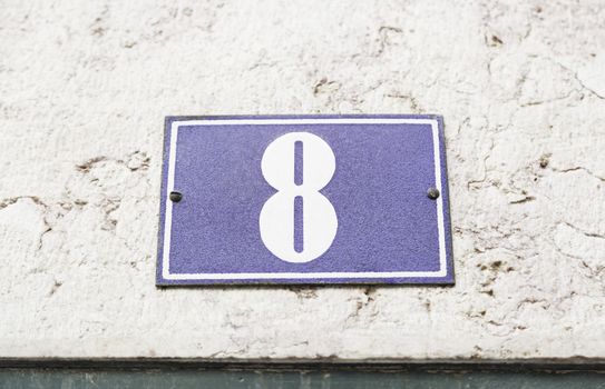 Number eight on a wall, detail of a number