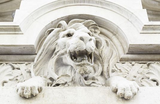Stone lion statue, detail of a statue carved in stone, art