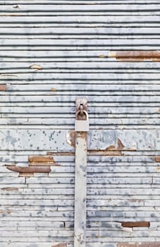 Chipped and rusty metal wall, detail of a down and dirty in ciuad wall, background with texture