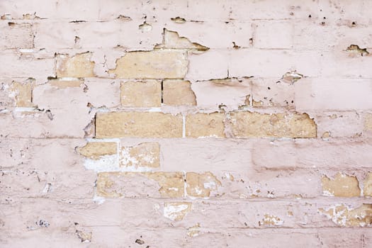 Brick Wall battered and abandoned, detail of a wall in the city in ruins, neglect and dirt textured background