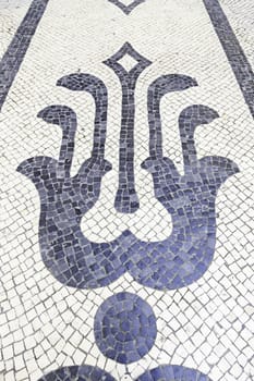 Typical stone floor Lisbon, detail of a typical floor with shapes and drawings, art Portugal, tourism