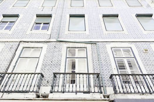 Typical facade tiles in Lisbon, facade detail of an ancient decorated