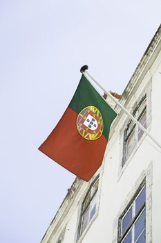 Flag of Portugal, detail of a flag waving in the street