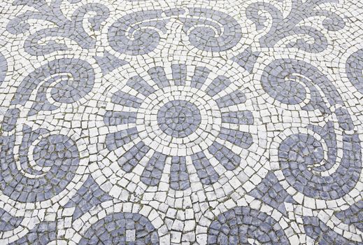 Lisbon typical mosaic, detail of a mosaic in an old typical Lisbon street, urban art