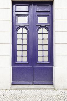 Classic blue door, detail of a door in a house, security and