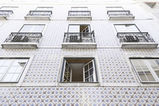 Typical facade tiles in Lisbon, facade detail of an ancient decorated