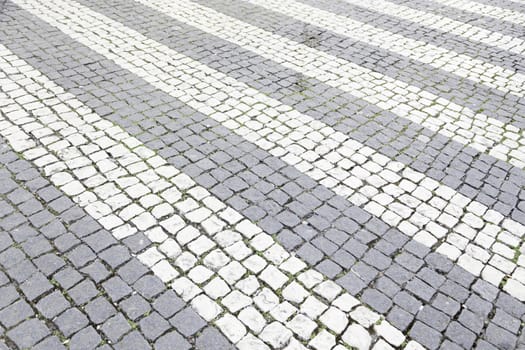 Typical stone floor Lisbon, detail of a typical floor with shapes and drawings, art Portugal, tourism