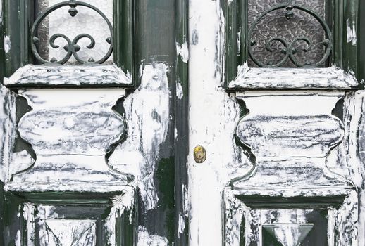 Old dirty wooden door, detail of a closed door and painted abandoned