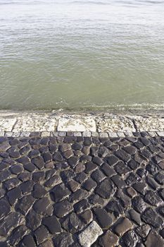 Sidewalk to walk on the seashore, detail of an area to walk near the water