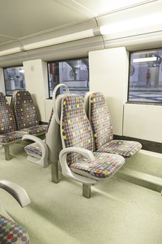 Seats on a train, detail of a new public transport, modernity and progress