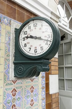 Old town clock in the city, detail of a watch for information in a train station