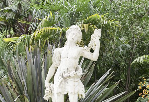 Stone statues in a garden in Sintra, detail of art in stone outdoors, tourism and art