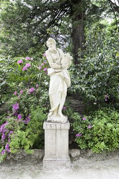 Stone statues in a garden in Sintra, detail of art in stone outdoors, tourism and art