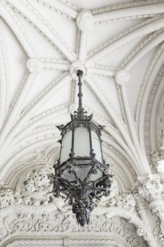 Old street lamp on the ceiling, detail of a lamp to illuminate