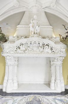 Old stone fireplace decorated interior detail of a monuento, ancient architecture