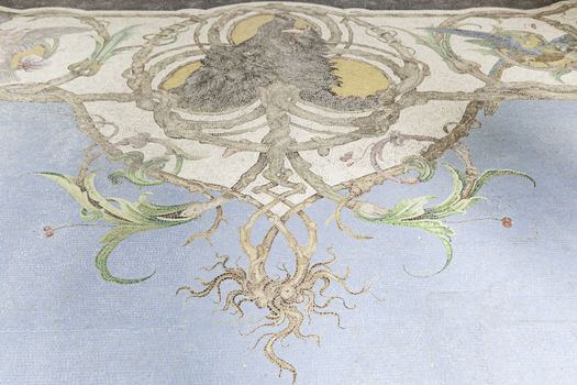 Old stone mosaic, detail of a wall decorated with colored stones, textured background