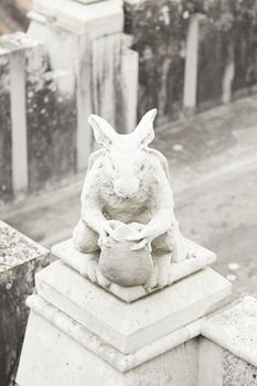 Old gargoyle shaped rabbit closeup of a figure of old rabbit