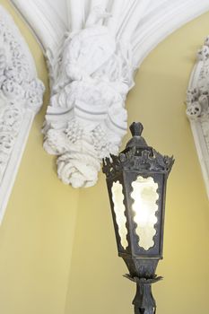 Old street lamp on the ceiling, detail of a lamp to illuminate