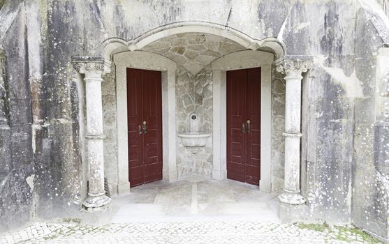 Door and window old, abandoned, detail of the facade of an old stone house