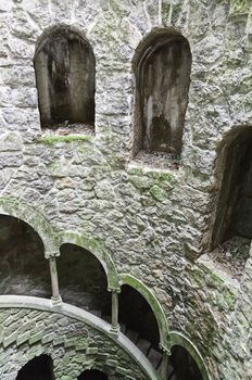 The Initiation well of Quinta da Regaleira in Sintra, Portugal. It's a 27 meter staircase that leads straight down underground and connects with other tunnels via underground walkways. 