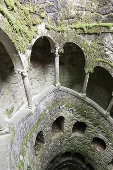 The Initiation well of Quinta da Regaleira in Sintra, Portugal. It's a 27 meter staircase that leads straight down underground and connects with other tunnels via underground walkways. 