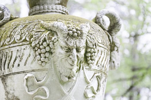 Vase with detail of a goat, old stone object, classical art