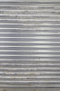 Dirty and damaged metal wall, detail of a metallic textured background