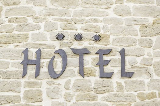 Signal three star hotel, detail of a text information of a hotel accommodation, signal and symbol