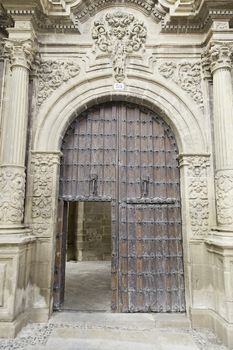 Old wooden door of a medieval church, detail of a decorated door, protecting, historic monument