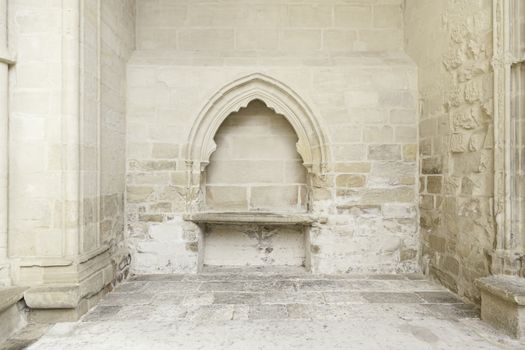 Stone wall inside a church, detail of the interior of a monument in ruins, ruin and abandonment