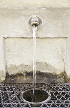 Antique water fountain, detail of a source for drinking water, drinking water