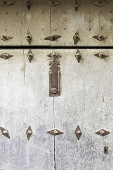 Abandoned wooden old door, detail of a door in the city, neglect and ruin, antique