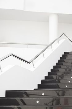 Black marble stairs, detail of the interior of a modernist building, modern architecture