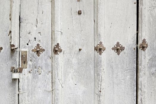 Abandoned wooden old door, detail of a door in the city, neglect and ruin, antique
