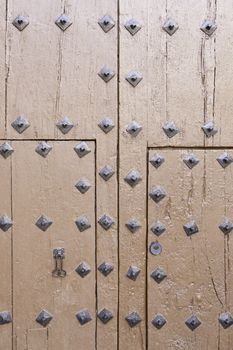 Abandoned wooden old door, detail of a door in the city, neglect and ruin, antique