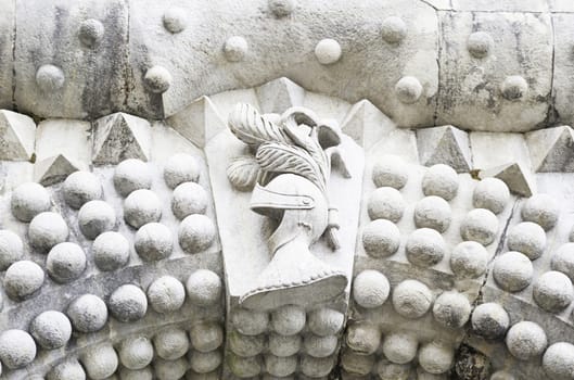 Old medieval stone shield, a bow detail at a castle in Sintra, ancient architecture