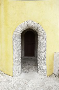 Old wooden door in Sintra, detail of a palace in a decorated door Portugal, architecture, tourism